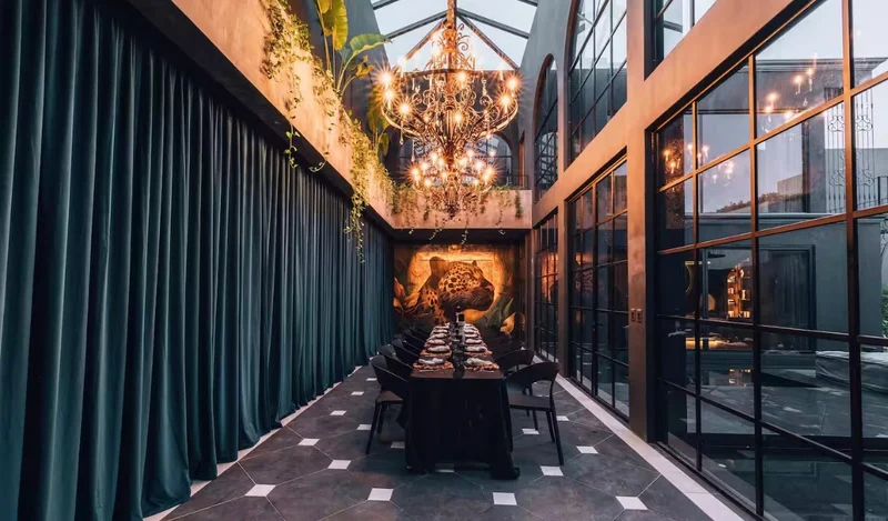 Candlelit dining room under a chandelier